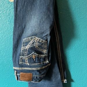 7 pairs of jeans all sized between 11-16